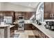Modern kitchen with stainless steel appliances, granite countertops, and ample cabinet space at 8048 Canyon Lake Cir, Orlando, FL 32835