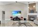 Inviting living room features a large TV, fireplace, and comfortable seating, ideal for entertainment at 8048 Canyon Lake Cir, Orlando, FL 32835