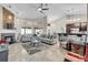 Bright, open living room featuring a stone fireplace, neutral decor, and plenty of seating for entertaining at 8048 Canyon Lake Cir, Orlando, FL 32835
