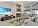 Cozy living room with a stone fireplace, large TV, and comfortable seating, perfect for relaxing at 8048 Canyon Lake Cir, Orlando, FL 32835