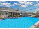 Sparkling pool with screened enclosure and outdoor kitchen offers perfect relaxation and entertainment space at 8048 Canyon Lake Cir, Orlando, FL 32835