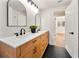 Bathroom featuring double vanity with quartz countertops and modern fixtures at 133 Pinecrest Dr, Sanford, FL 32773