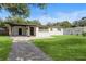 Beautifully landscaped front yard with lush green grass and inviting curb appeal at 133 Pinecrest Dr, Sanford, FL 32773