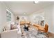 Bright living room featuring hardwood floors, a sofa, and an accent rug at 133 Pinecrest Dr, Sanford, FL 32773