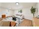 Bright living room featuring hardwood floors, a sofa, and an accent rug at 133 Pinecrest Dr, Sanford, FL 32773