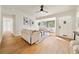 Living room with wood flooring, neutral color palette, and bright natural light at 133 Pinecrest Dr, Sanford, FL 32773