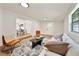 Bright living room featuring hardwood floors, a sofa, and an accent rug at 133 Pinecrest Dr, Sanford, FL 32773