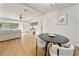 Bright, open-concept living space with hardwood floors and modern furnishings at 133 Pinecrest Dr, Sanford, FL 32773