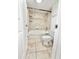 Bright bathroom featuring a shower and bathtub combo with tile surround, a toilet, and tiled flooring at 1918 Conway Rd # 3, Orlando, FL 32812