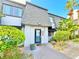 Charming townhome featuring a unique architectural design and lush landscaping at 1918 Conway Rd # 3, Orlando, FL 32812
