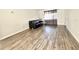 Bright living room featuring hard wood floors and a comfy couch at 1918 Conway Rd # 3, Orlando, FL 32812