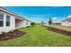 Spacious backyard with green lawn and beautiful water views at 2990 Arranmore Dr, Ormond Beach, FL 32174