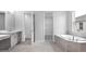 Bright bathroom showcasing dual sinks, a soaking tub, and a separate shower at 2990 Arranmore Dr, Ormond Beach, FL 32174