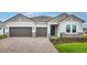 Charming single-story home with a two-car garage and well-maintained landscaping at 2990 Arranmore Dr, Ormond Beach, FL 32174