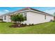 Well-maintained home with a lush lawn and mature landscaping at 2990 Arranmore Dr, Ormond Beach, FL 32174