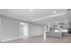 Open-concept living area with light gray walls, recessed lighting, and sleek cabinetry at 2990 Arranmore Dr, Ormond Beach, FL 32174