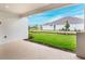Relaxing covered patio with a view of the lush backyard at 2990 Arranmore Dr, Ormond Beach, FL 32174