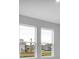 Bright and airy living area with two large windows offering scenic views at 2990 Arranmore Dr, Ormond Beach, FL 32174