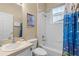 Clean bathroom with a tub, shower, and updated fixtures at 401 Montara Dr, Davenport, FL 33897
