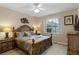 Spacious bedroom with a king-size bed and en-suite bathroom at 401 Montara Dr, Davenport, FL 33897