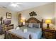 King-size bed, nightstands, and dresser in a well-lit bedroom at 401 Montara Dr, Davenport, FL 33897