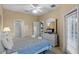 Main bedroom with king bed, dresser, and private access to bathroom at 401 Montara Dr, Davenport, FL 33897