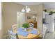 Charming dining area with a table and chairs, offering a view of the kitchen at 401 Montara Dr, Davenport, FL 33897