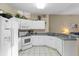 Bright kitchen with white cabinets, modern appliances, and ample counter space at 401 Montara Dr, Davenport, FL 33897