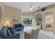 Open living space with comfy seating, pool view, and a glimpse into a bedroom at 401 Montara Dr, Davenport, FL 33897