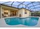 Inviting kidney-shaped pool with screened enclosure at 401 Montara Dr, Davenport, FL 33897