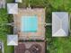 Community pool with surrounding lounge chairs at 4712 Anson Ln, Orlando, FL 32814
