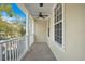 Private balcony features tile flooring and ceiling fan at 4712 Anson Ln, Orlando, FL 32814