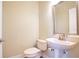 Updated bathroom with pedestal sink and frame mirror at 4712 Anson Ln, Orlando, FL 32814