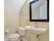 Small bathroom with pedestal sink and toilet at 4712 Anson Ln, Orlando, FL 32814