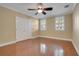Bright bedroom with hardwood floors and double door closet at 4712 Anson Ln, Orlando, FL 32814