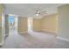 Spacious bedroom with carpeted floor and ceiling fan at 4712 Anson Ln, Orlando, FL 32814