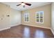 Bright bedroom with hardwood floors, plantation shutters and ceiling fan at 4712 Anson Ln, Orlando, FL 32814
