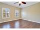 Large bedroom with hardwood floors and plantation shutters at 4712 Anson Ln, Orlando, FL 32814