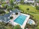 An aerial view of the community pool, clubhouse, and surrounding area at 4712 Anson Ln, Orlando, FL 32814