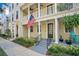 Inviting exterior of a charming townhome with a front porch and well-manicured landscaping at 4712 Anson Ln, Orlando, FL 32814