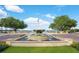 Landscaped fountain with a view of the lake at 4712 Anson Ln, Orlando, FL 32814