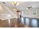 Spacious living room with dark hardwood floors and ceiling fan at 4712 Anson Ln, Orlando, FL 32814