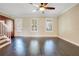 Bright living room featuring hardwood floors and plantation shutters at 4712 Anson Ln, Orlando, FL 32814