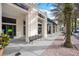 Exterior view of retail spaces with sidewalks and benches at 4712 Anson Ln, Orlando, FL 32814