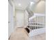 Stylish staircase with white railings and dark wood steps at 4712 Anson Ln, Orlando, FL 32814