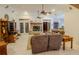 Bright living room featuring a stone fireplace and comfortable seating at 6408 Shoreline Ct, St Cloud, FL 34771