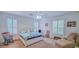 Spacious bedroom with neutral carpet, ceiling fan and abundant natural light at 6408 Shoreline Ct, St Cloud, FL 34771