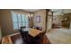 Dining room features wood floors and a chandelier at 6408 Shoreline Ct, St Cloud, FL 34771
