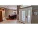 Charming entryway featuring a half moon window above the front door and dining room view at 6408 Shoreline Ct, St Cloud, FL 34771