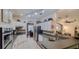Bright kitchen with sleek appliances, white cabinets, and open layout at 6408 Shoreline Ct, St Cloud, FL 34771